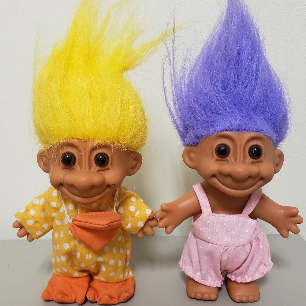 Trolls dressed as a duck and a bunny.